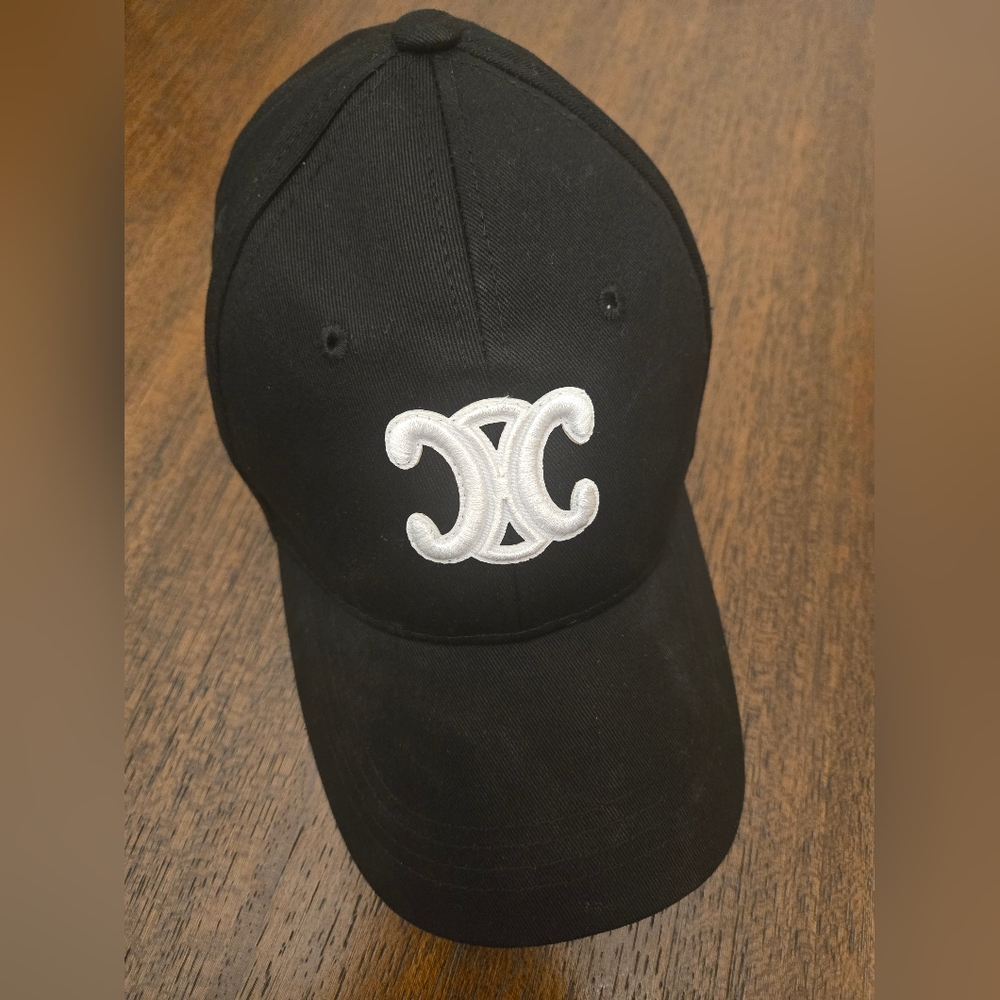 Black Cap with White Label Tag States word CELINE